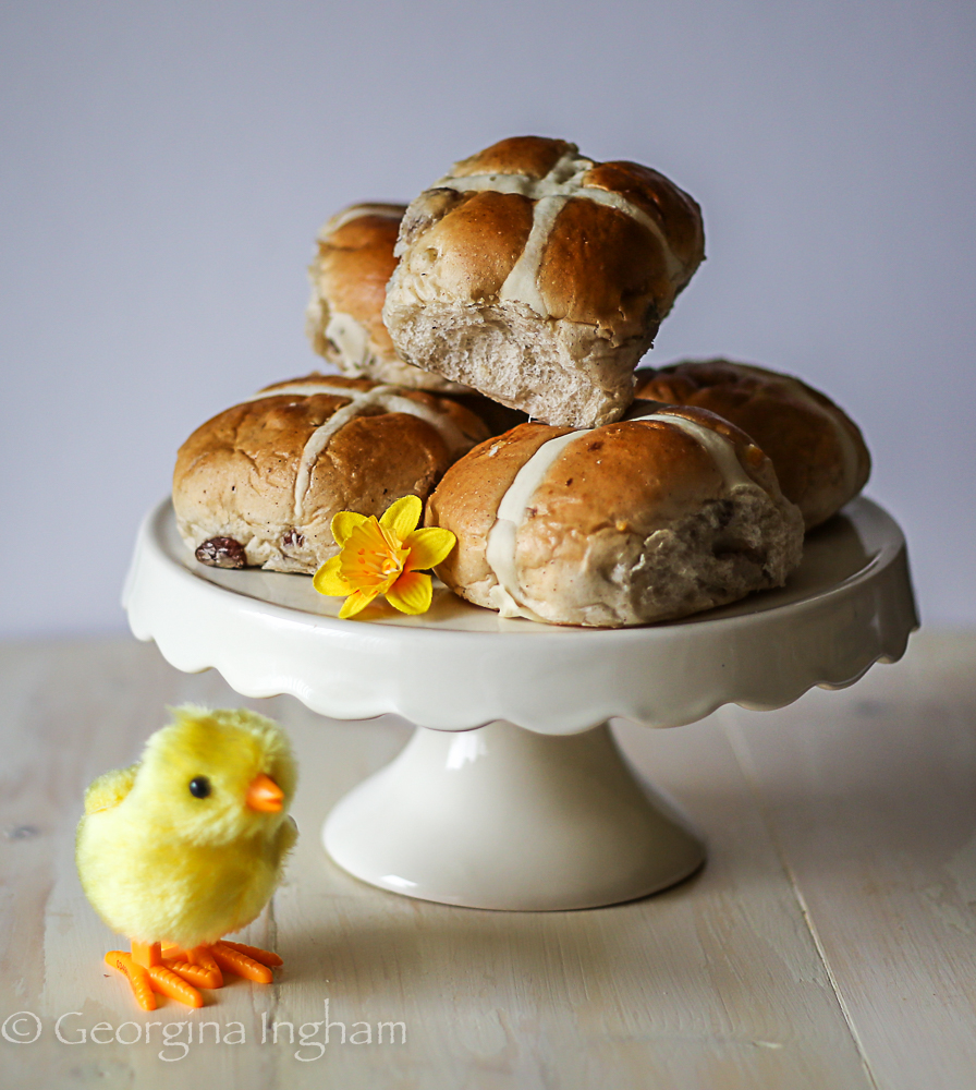 stack of hot cross buns ready to enjoy warm from the oven